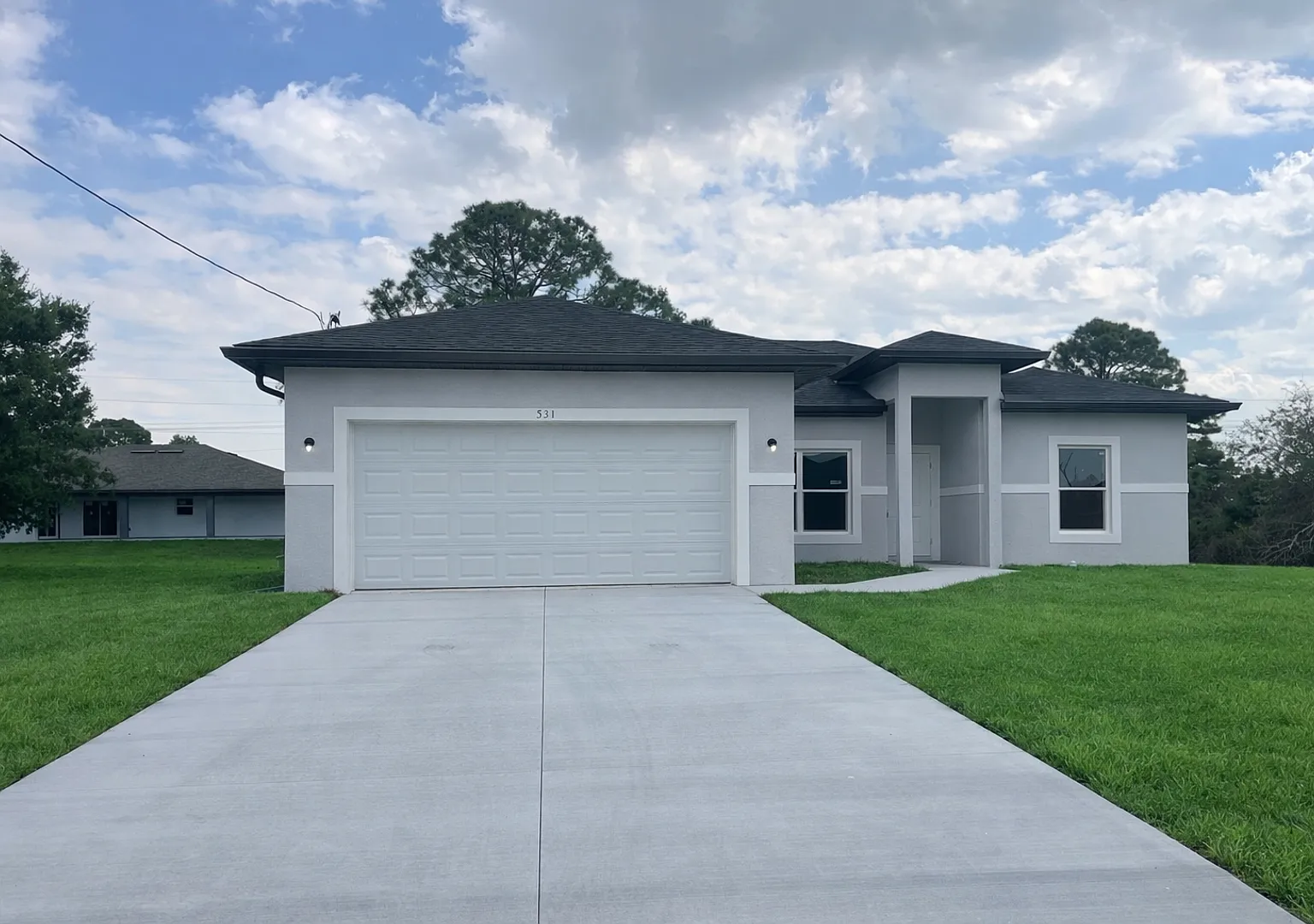 New 4 Bed / 2 Bath / 2 Car Garage Family Retreat in Desirable Lehigh Acres! — Photo 1
