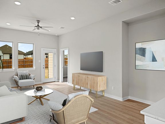 Living Room in the Birch home plan by Trophy Signature Homes - REPRESENTATIVE PHOTO