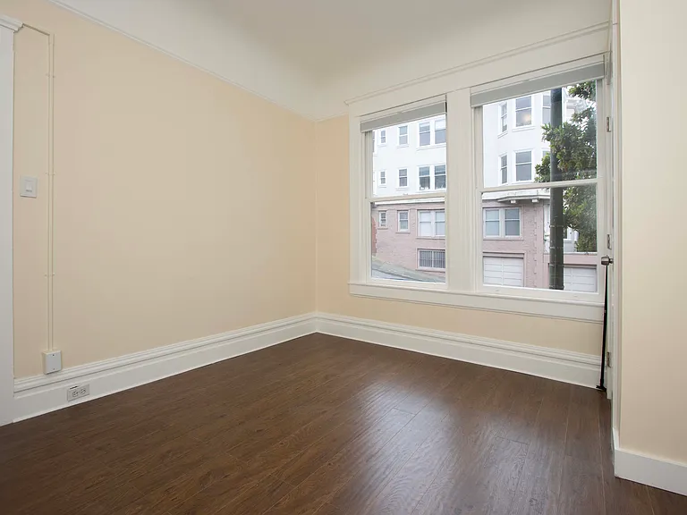 Another view of the front bedroom (from the NW corner near the wall heater shown previously)
