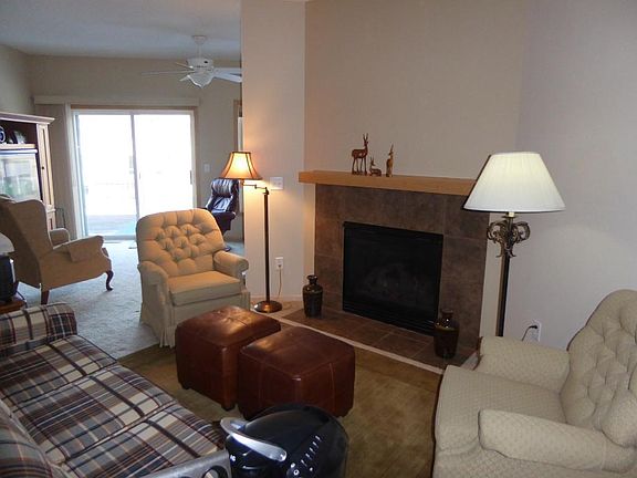 RELAXED GLAMOUR Livingroom with cozy fireplace along side of formal dine