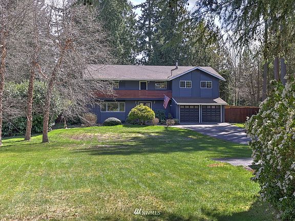 Set back from the road, spacious front yard.