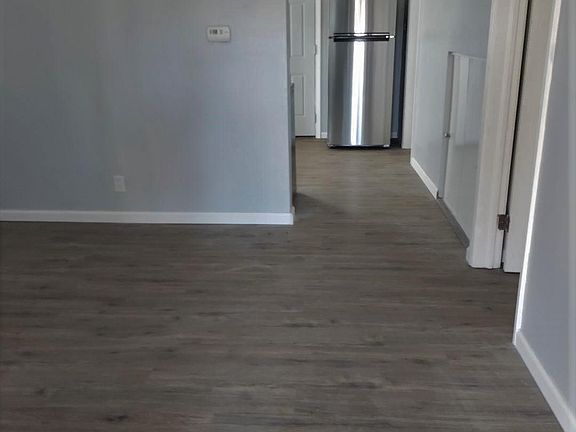 Looking in from the front door. Bedroom is the door on the right.