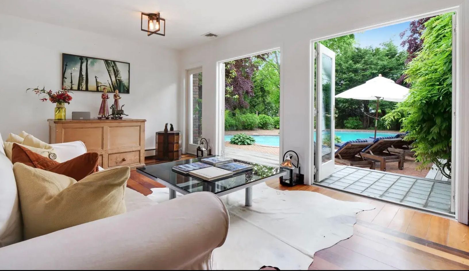  view from living exiting to pool area, large french doors