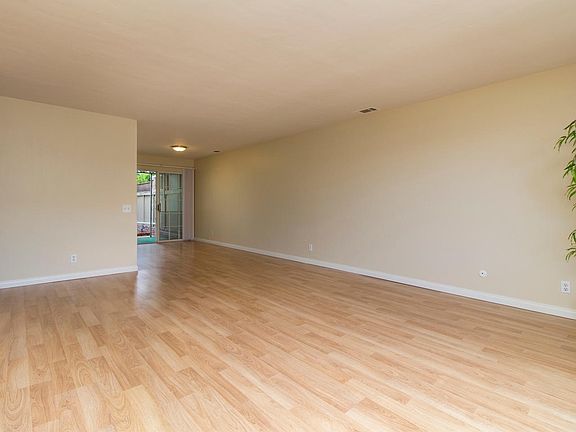 The flooring is mostly light laminated wood which makes the home very light & bright.