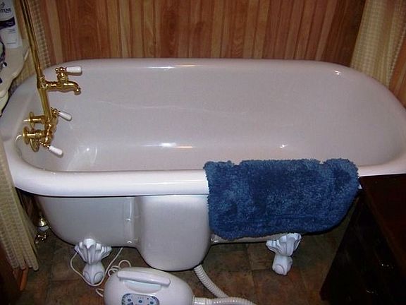 ...Featuring a Jetted Claw Foot Tub