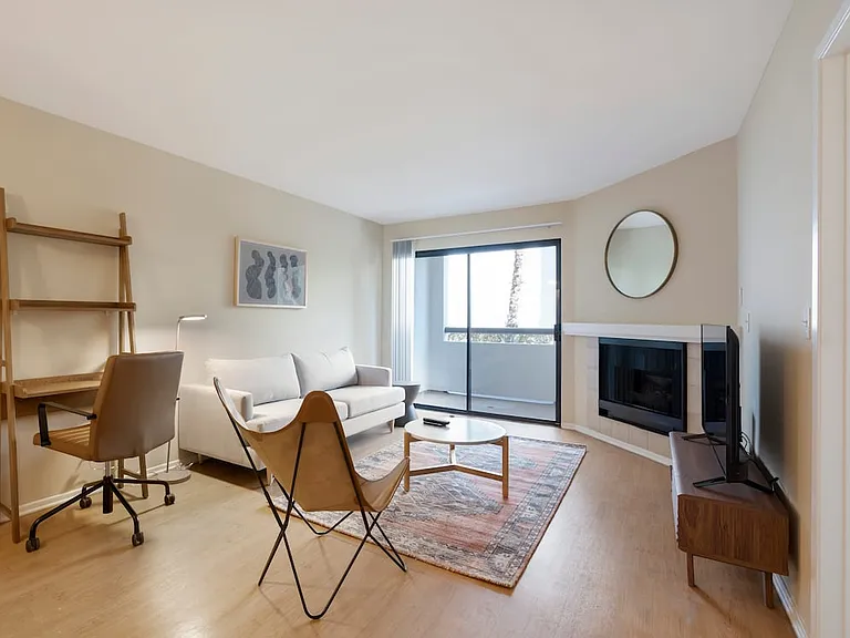 Furnished+ apartment homes come outfitted with a sofa, side chair, side table, coffee table, TV stand and 50" Television (Representative Image exact items and style of furnishings may vary)