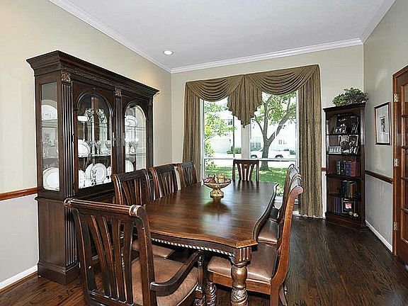 Another view of dining room & large window overlooking front lawn