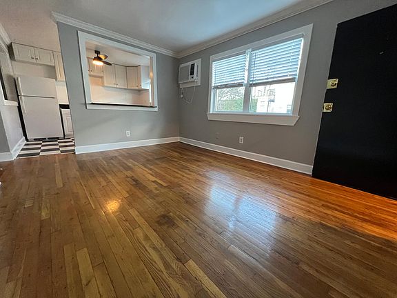 Large living room with hardwood flooring