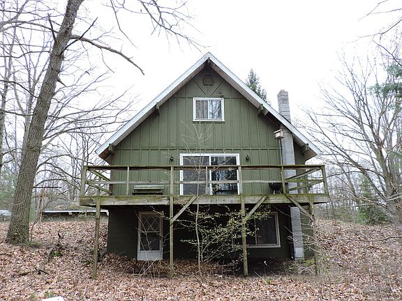 Back of the home showing the walk out and the deck.