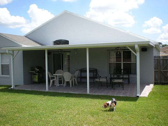 Back porch (covered, tiled, with 2 fans and speakers)