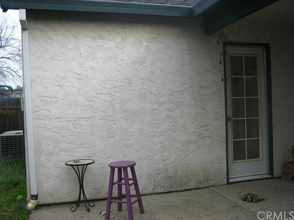 Covered patio with door from master bedroom.