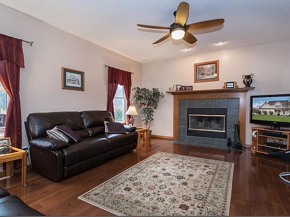 Spacious family room/hardwood floors/lovely fireplace that is both wood burning and electric....visi