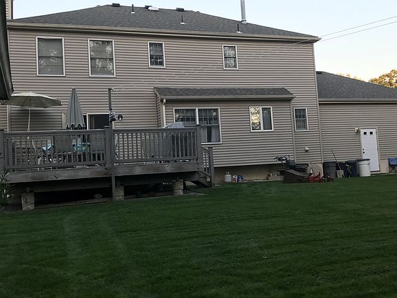 Enjoying the Large Deck in privacy and beautiful landscaped turf