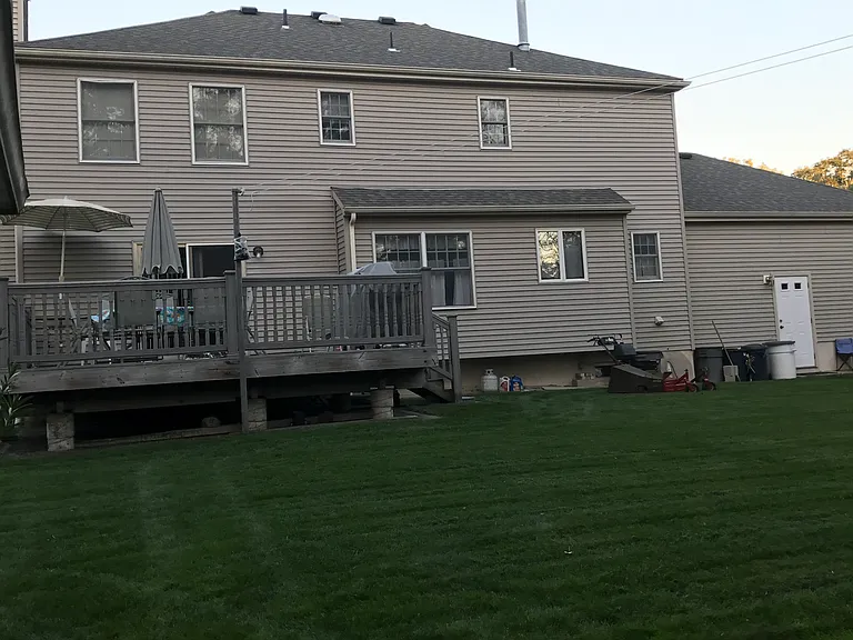 Enjoying the Large Deck in privacy and beautiful landscaped turf
