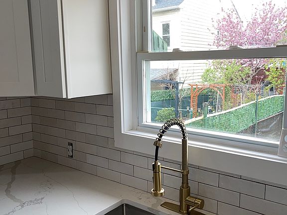 Kitchen sink looking onto private backyard