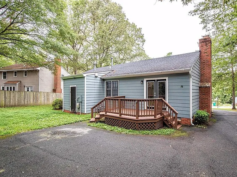 Back of the house. Nice and private. Partially fenced in.