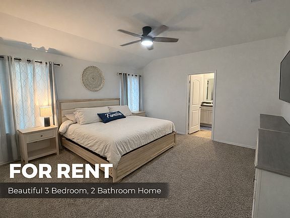 Large master bedroom with ceiling fan