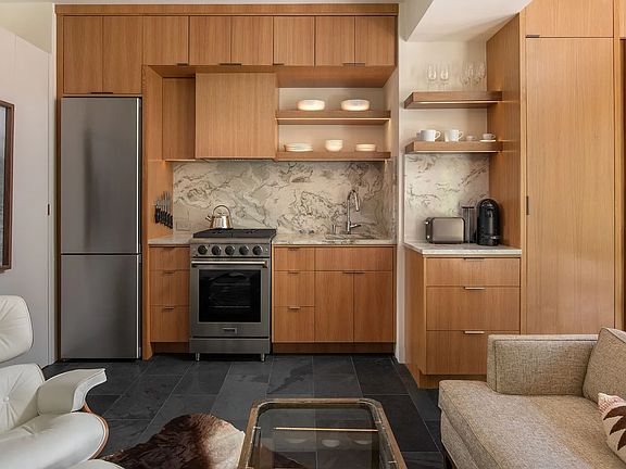 Kitchen, German Liebherr refrigerator with ice maker, Thor oven, 4 burner stove, sink with garbage disposal, water filter, Nespresso Coffee, all flatware, glassware, untensils, etc