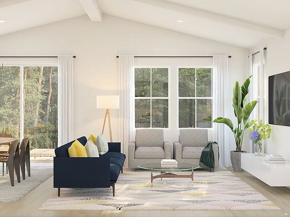 Great room with vaulted ceiling and white ceiling beams