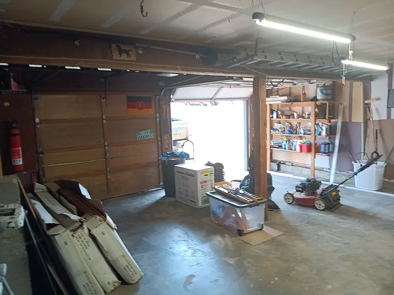 Two car garage with tool bench.