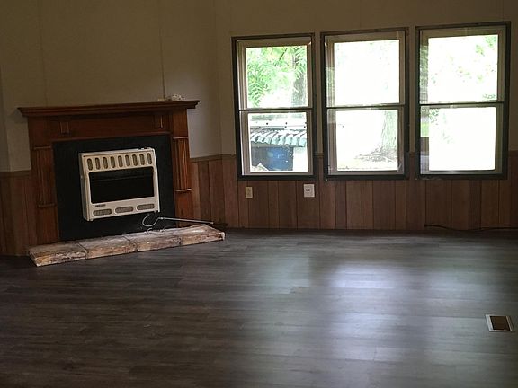 Family Room w/ new flooring and vaulted ceiling!