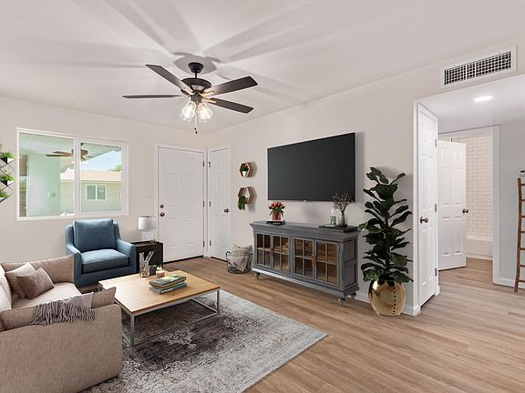 Living Room furniture. In this photo we are in the kitchen entry looking towards the front door. To the right is the hallway where there's a storage room on the left and W/D on the right. Bedrooms are on opposite sides of the hallway with the bathroom (