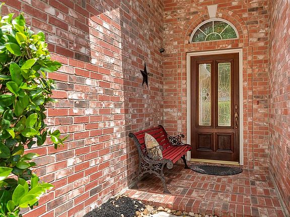 The front porch is a great spot for dÃ©cor and makes for a cozy entry.