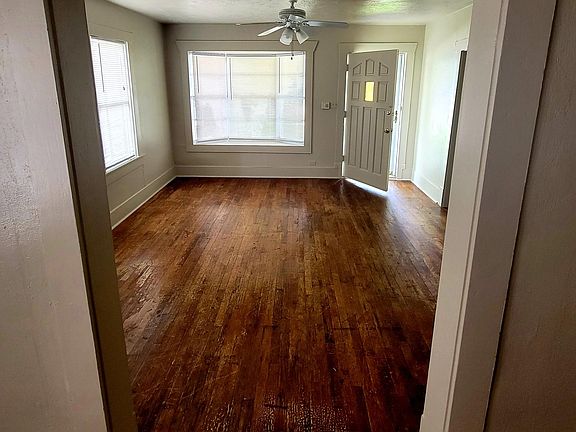 Living Room, new paint through out entire house and new mini blinds in every room.