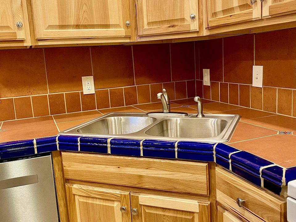 new sink, dishwasher, custom tile countertops, backsplash, electric outlets