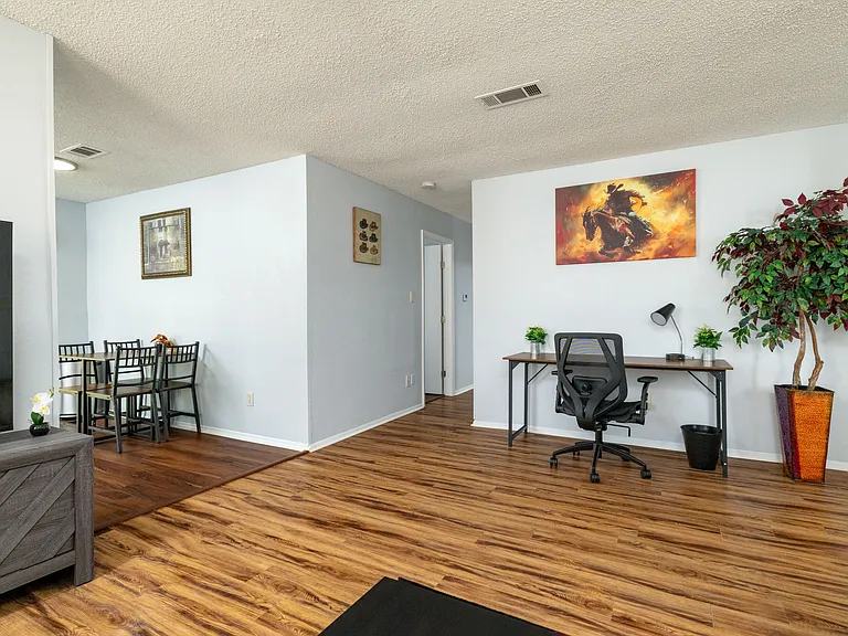 Stay productive at our dedicated workspace, featuring a large desk and ergonomic chair.