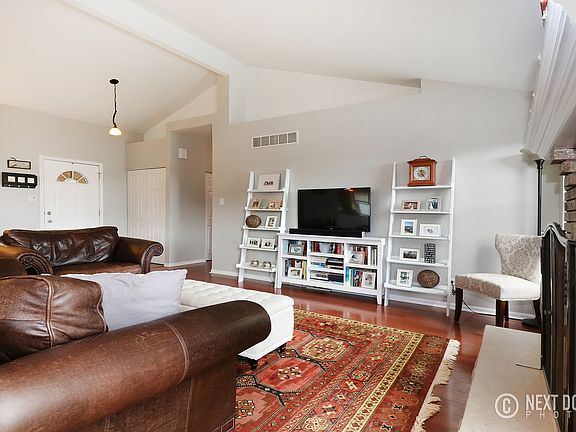 Gorgeous, light filled, open concept space with wood burning fireplace.