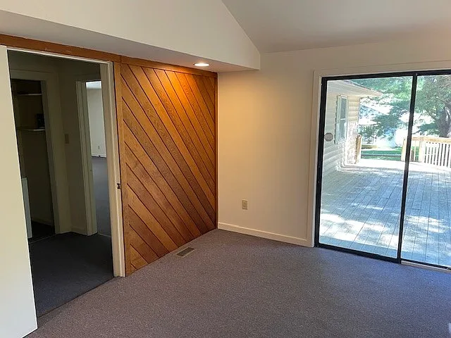 Extra room for home office/den showing access to shared deck