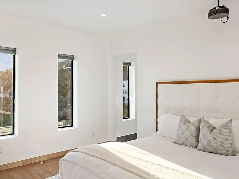 Our luxurious Guest Bedroom #3 is a haven of tranquility, featuring a king-size bed, Smart TV, and ensuite bath.