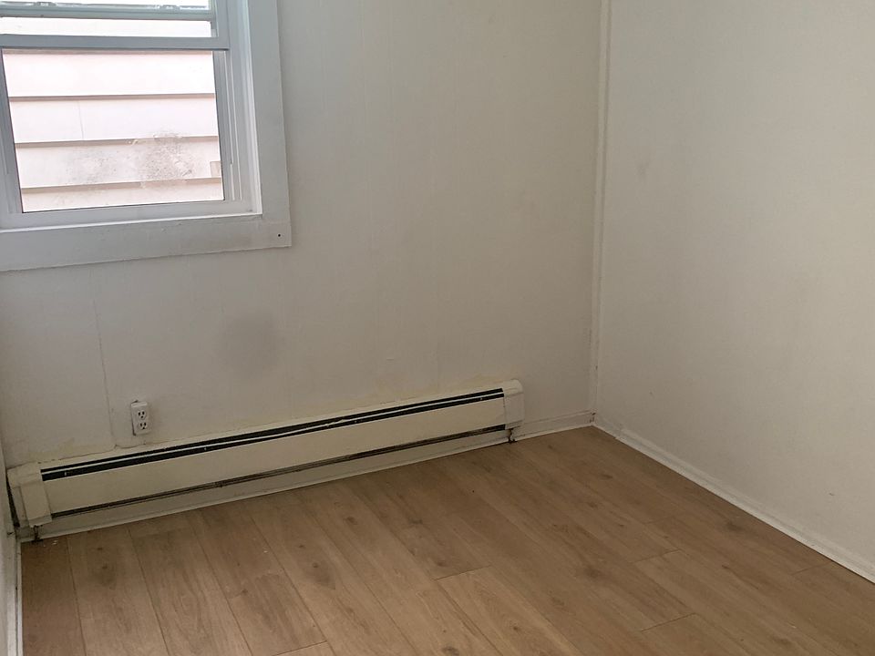 Bedroom 1 with Laminate Flooring and Window for ample light.