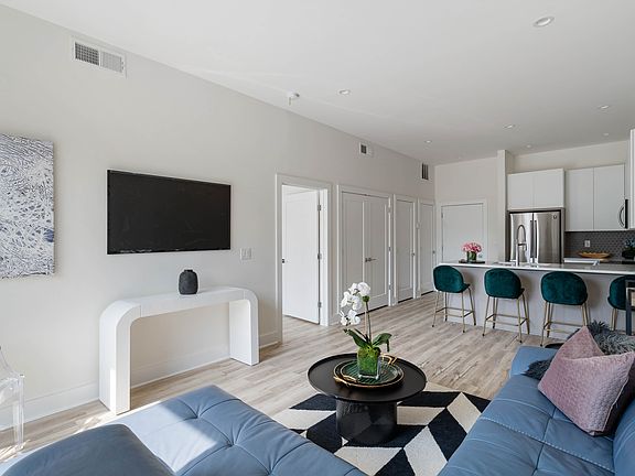 Living room w abundant natural light. Model Unit.