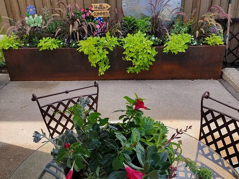Beautiful garden and BBQ area with seating.