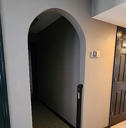 Arched doorway to the garage