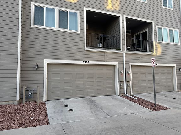 Two car attached garage leads into the bonus room/office area