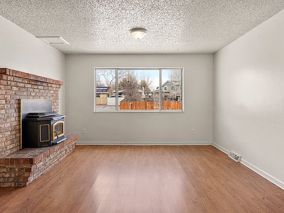 Upstairs living room with charming fireplace & mantle!