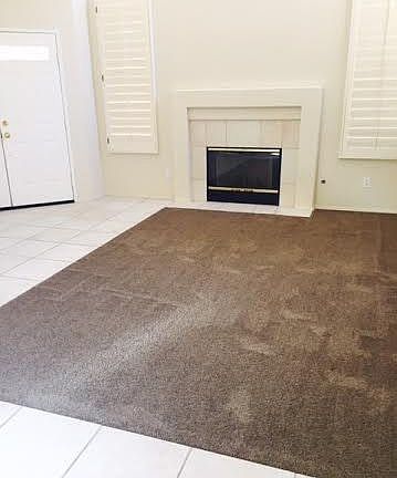 Living Room with Fireplace and new carpet