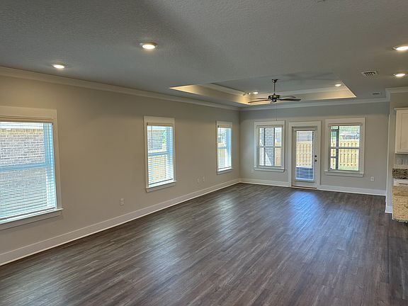 Large living room, kitchen, and dining room.