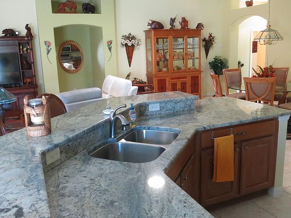 Granite kitchen counter open to living room, dinning room and breakfast area