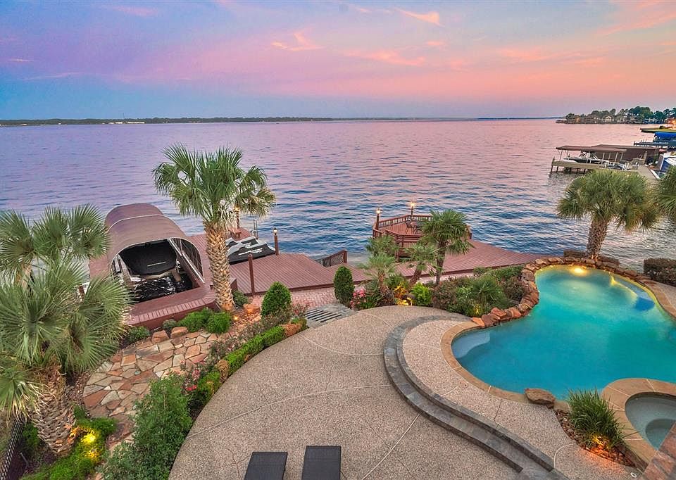 Beautifully landscaped oasis with landscape lights, paved walkways, and attention to detail you don't see everyday.