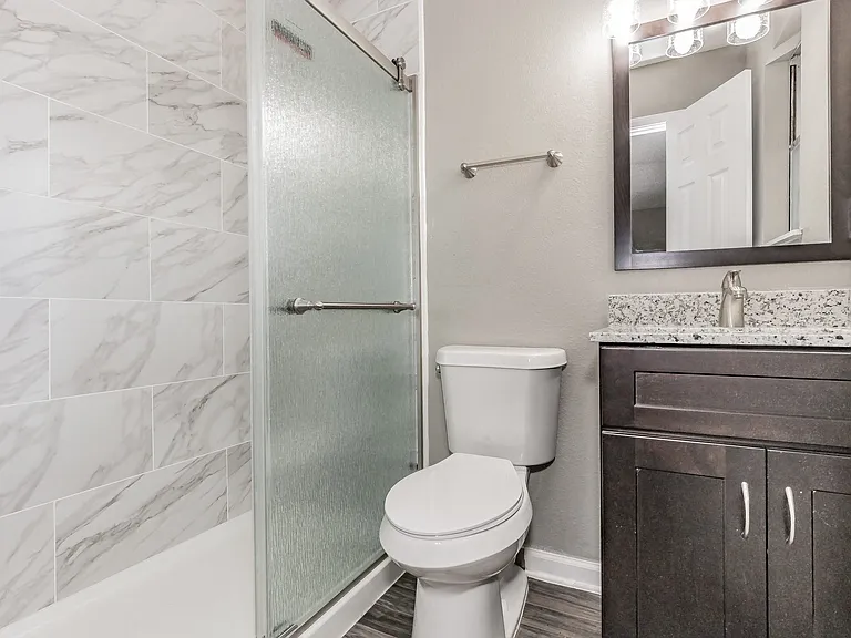 Experience refreshed bathroom designs with stylish vanities and bright finishes at Chapel Creek Apartments.