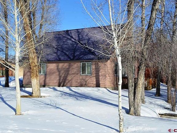 Located on the corner with lots of grassy space, seasonal pond and mature trees.  Nice deck, shade.
