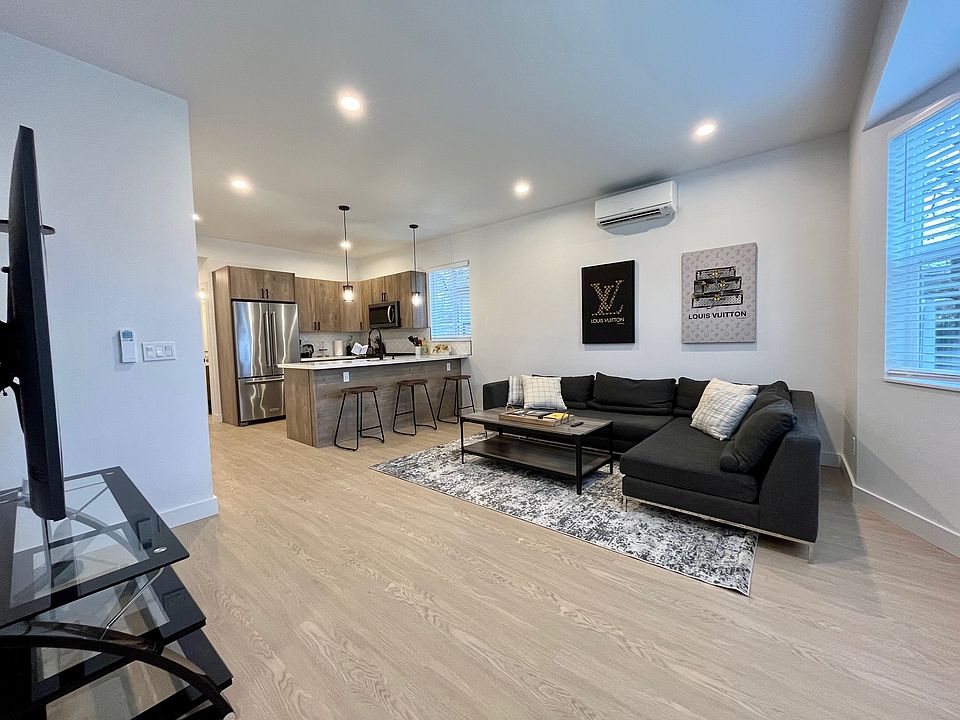 Fluid design, endless possibilities: An open layout that connects living and dining with a countertop that doubles as a convenient kitchen island.
