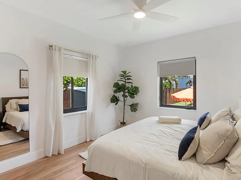 King second bedroom with a closet which overlooks the garden.