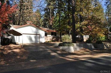 NICELY TREED AND COVERED RV ACCESS TO SIDE