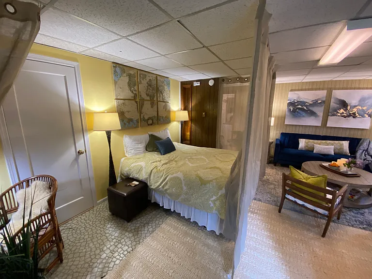 Baseboard heat keeps you warm in this space. The thermostat is located on the wall next to the bed so you can adjust accordingly.