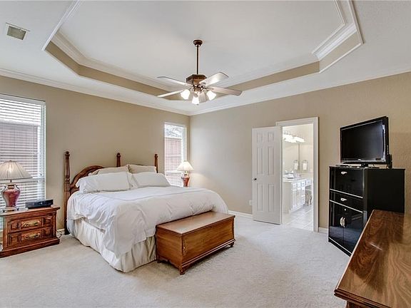 Master bedroom is open light and bright. Coffered ceiling. There is a large linen closet (not shown).
